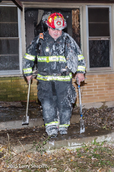 firefighter covered with foam 