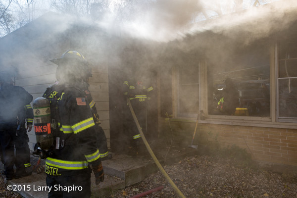 firefighters enter house filled with smoke
