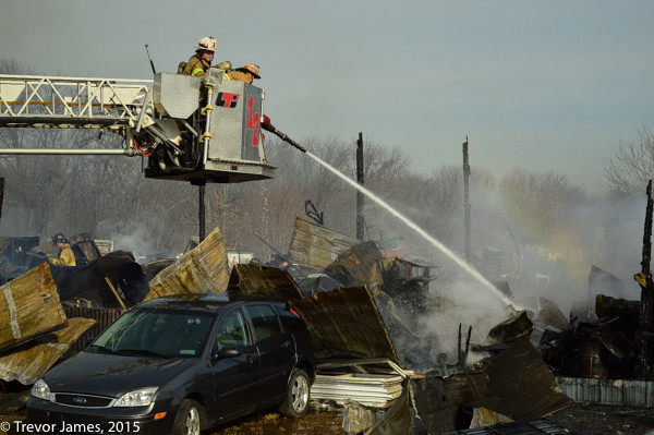 firefighters overhaul after large fire