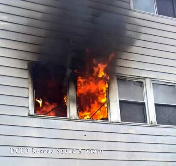 flames blowing out of a window