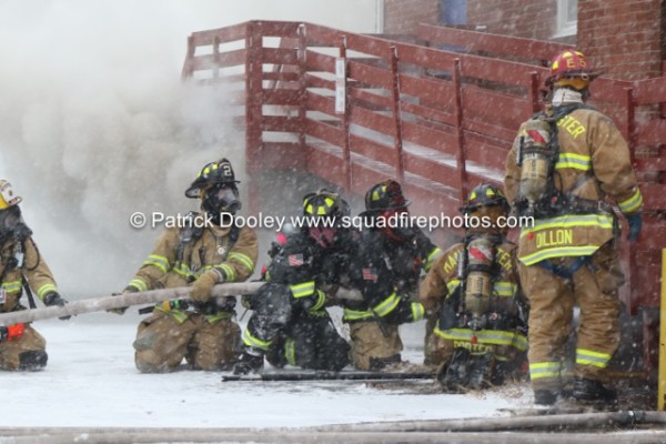 firefighters battle a winter fire