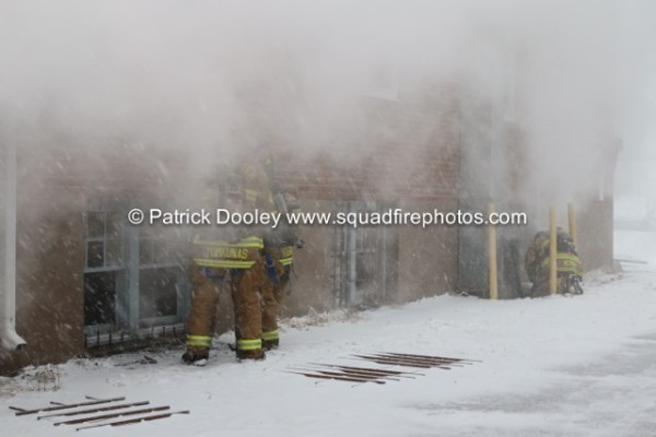 firefighters battle a winter fire