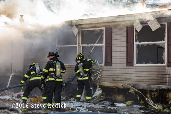 double-wide trailer mobile home gutted by fire