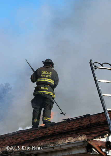 fireman on roof at house fire