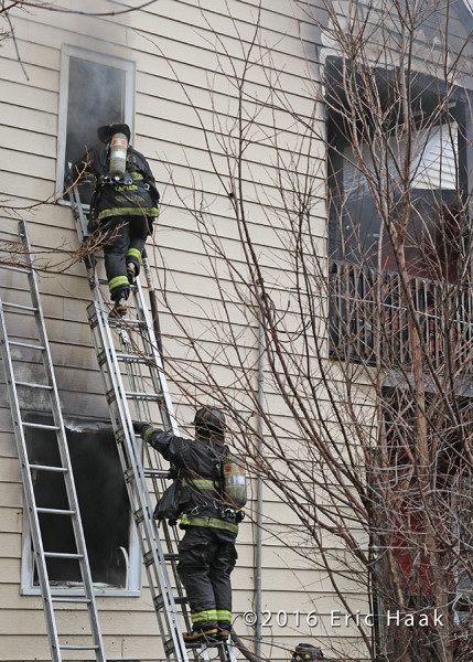 Chicago firefighters after battling a rear porches fire