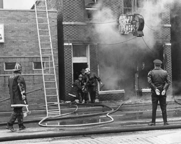 historic fire scene image of a victim rescue