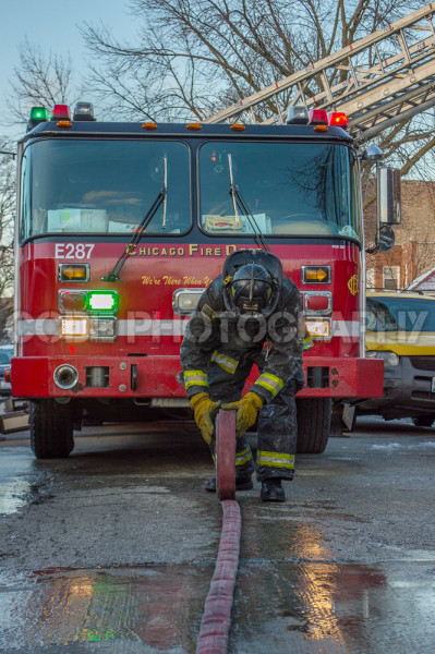 fireman rolling hose