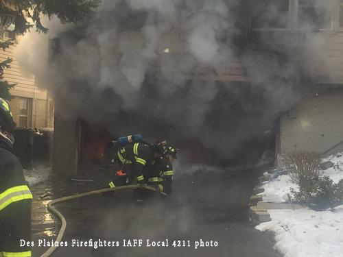 firefighters battle a winter house fire
