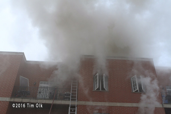 billowing smoke from building fire