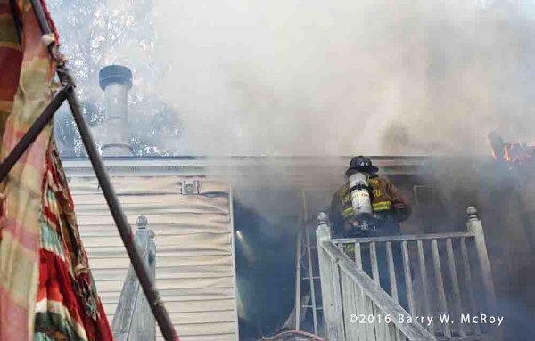 firefighters battle doublewide trailer fire