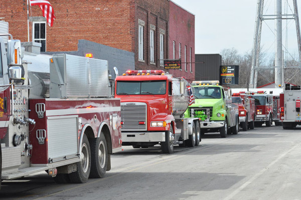 fire department water tankers staged at fire scene