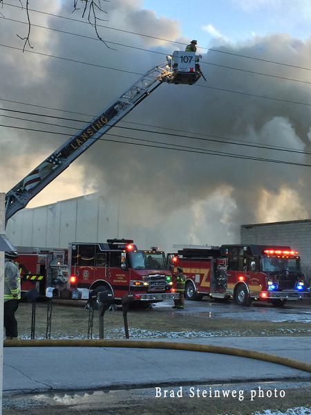 fire trucks working at a commercial building fire in East Hazel Crest IL