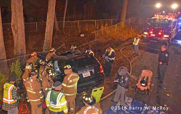 firefighters free driver trapped in SUV
