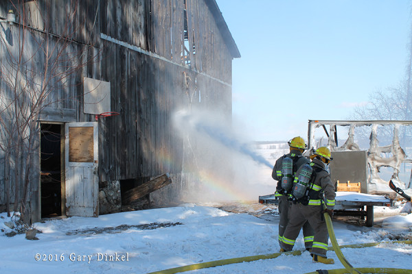 firefighters protect exposure during fire