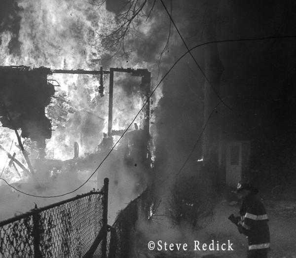 heavy flames at night fire scene