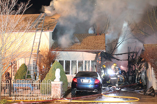 firefighters in Kitchener Ontario battle a house fire