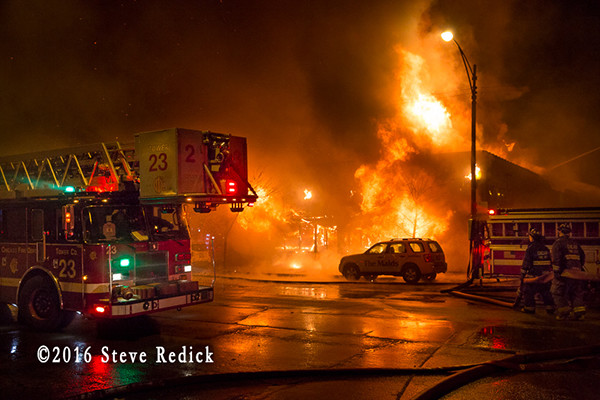 heavy fire from commercial building fire at night