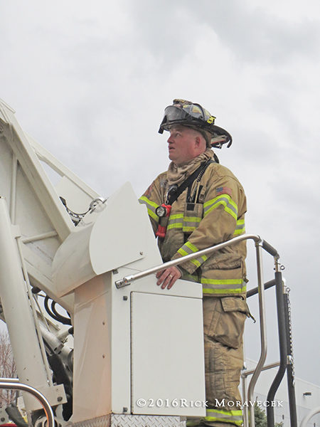 firefighter at turntable controls
