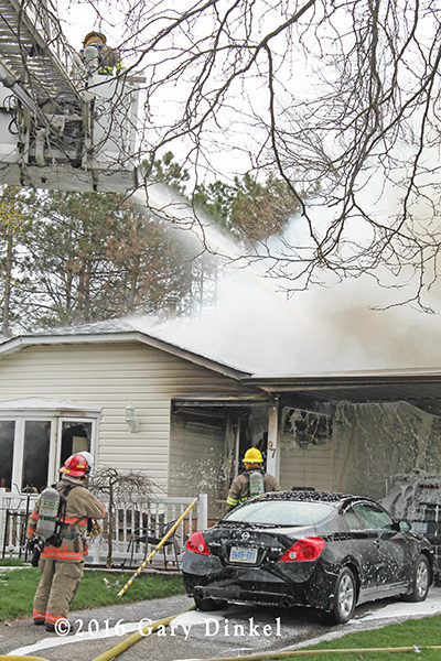 firefighters battle a house fire in Waterloo Ontario