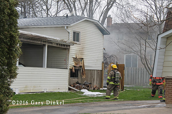 firefighters battle a house fire in Waterloo Ontario