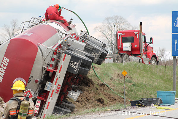 contractor offloads product from rolled over tanker truck