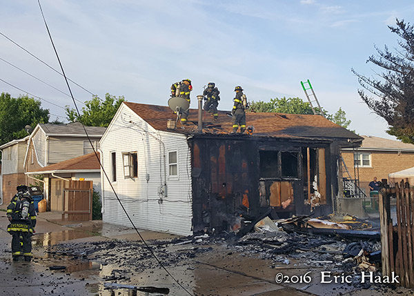 aftermath of alley garage destroyed by fire