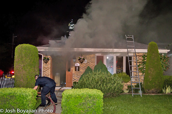 house fire with heavy smoke at night