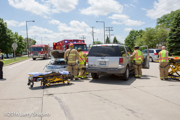 firefighters remove patient from car after crash