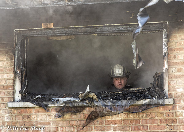 Chicago firefighter overhauls after house fire