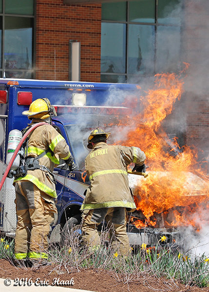 firemen battle an ambulance destroyed buy fire