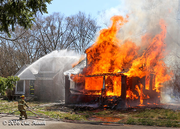 vacant house fully engulfed in flames