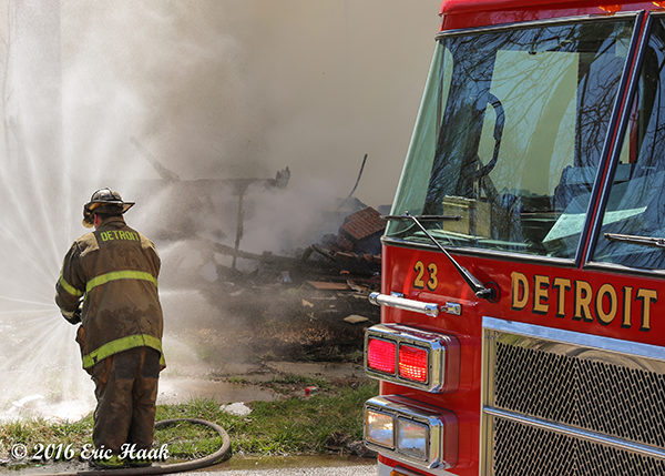 Detroit firefighter with hose line