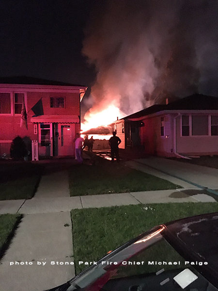 alley garage fully engulfed in flames