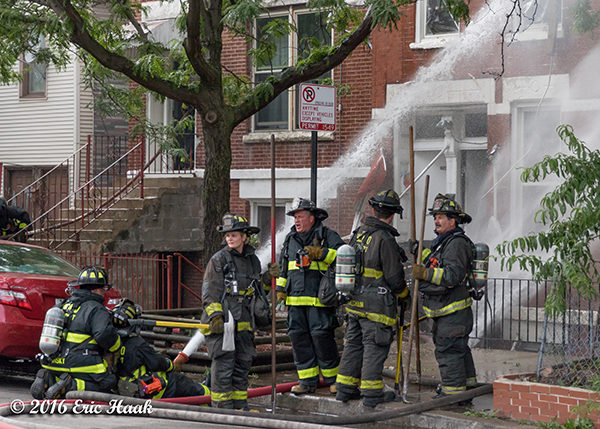 Chicago firefighters battle a house fire