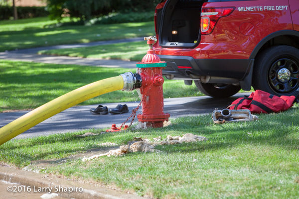 fire hydrant with hose connected