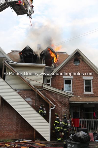 flames through roof of house fire