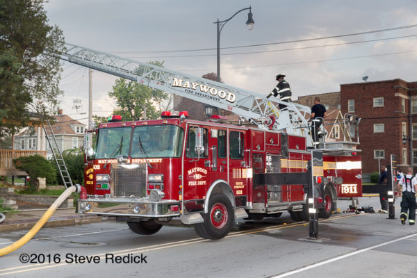 Maywood Fire Department ladder truck at fire scene