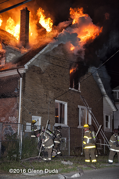 vacant dwelling gutted by fire in Detroit at night