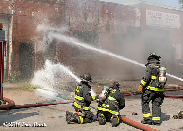 firefighters with big hose lines