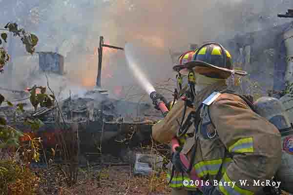 firefighters work after doublewide trailer home destroyed by fire
