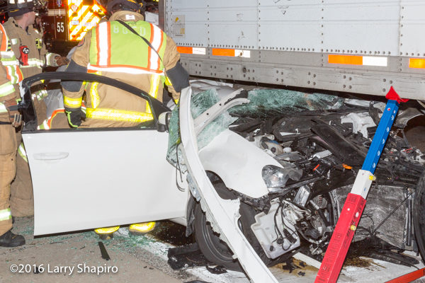 firefighters free trapped driver  from car wreck