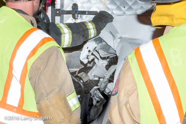 firefighters free trapped driver  from car wreck with Holmatro rescue tools