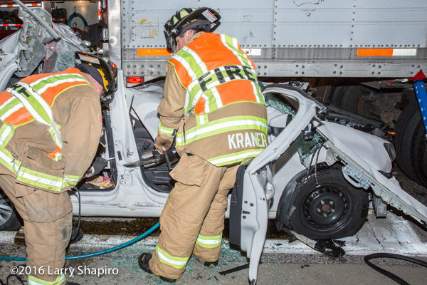 firefighters free trapped driver  from car wreck with Holmatro rescue tools