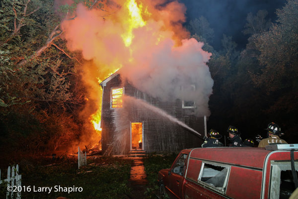 vacant house engulfed in fire