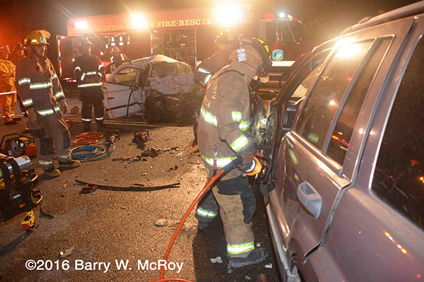 firefighters cut trapped driver from car after crash