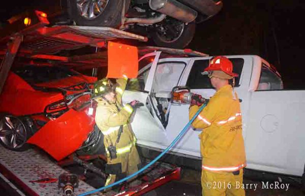 firefighters use Holmatro tools to cut driver from car