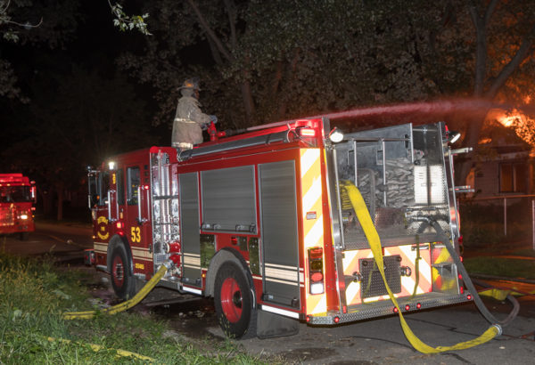 fire engine at night with hose off