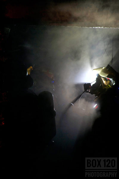 Firefighter silhouette at fire scene