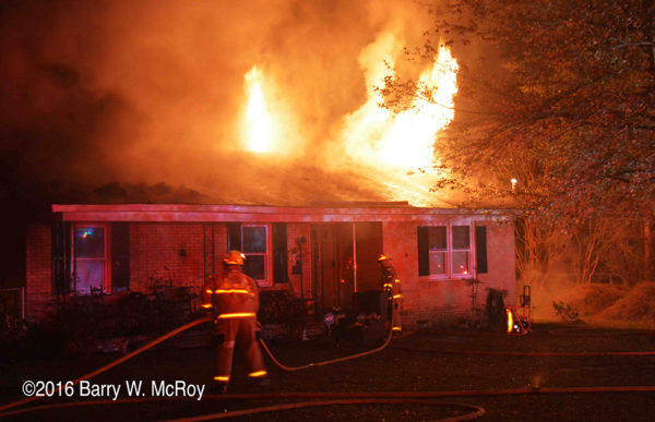 firefighters battle ranch house on fire with flames