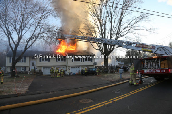 heavy smoke and flames from house fire in South Windsor CT